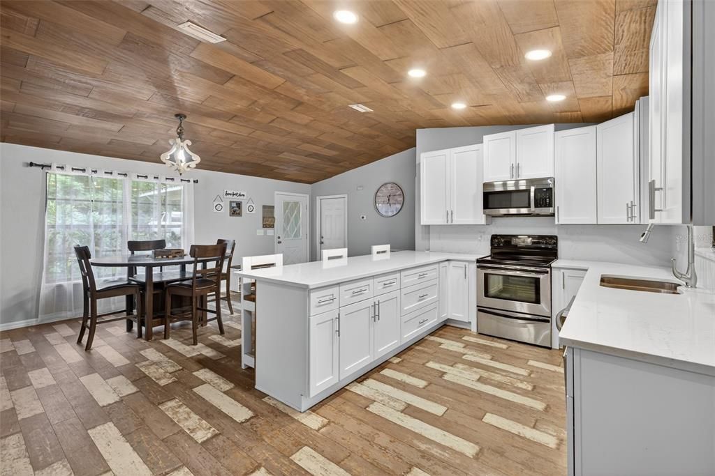 Dining room, Interior, Kitchen, Pendant Lights, Recessed Lighting, Stainless Steel Appliances, Wooden Ceilings, Wood Texture Flooring