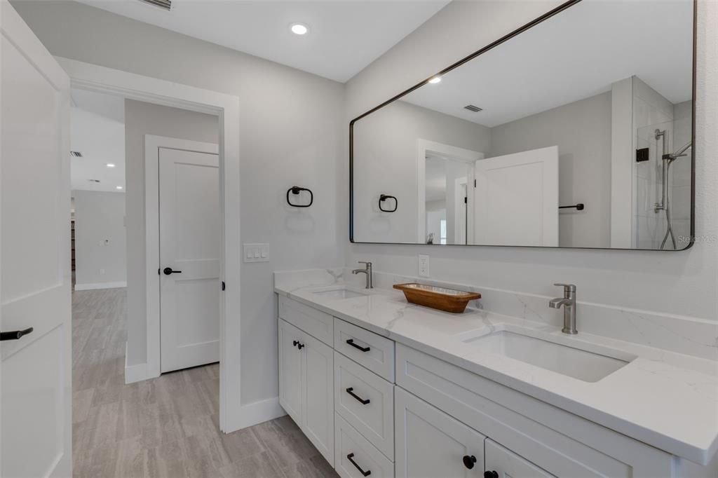 Bathroom, Dual Sink Vanities, Interior, Recessed Lighting, Wood Texture Flooring
