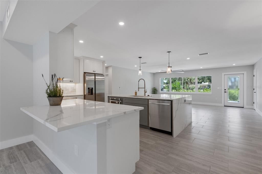 Interior, Kitchen, Pendant Lights, Recessed Lighting, Stainless Steel Appliances, Wood Texture Flooring