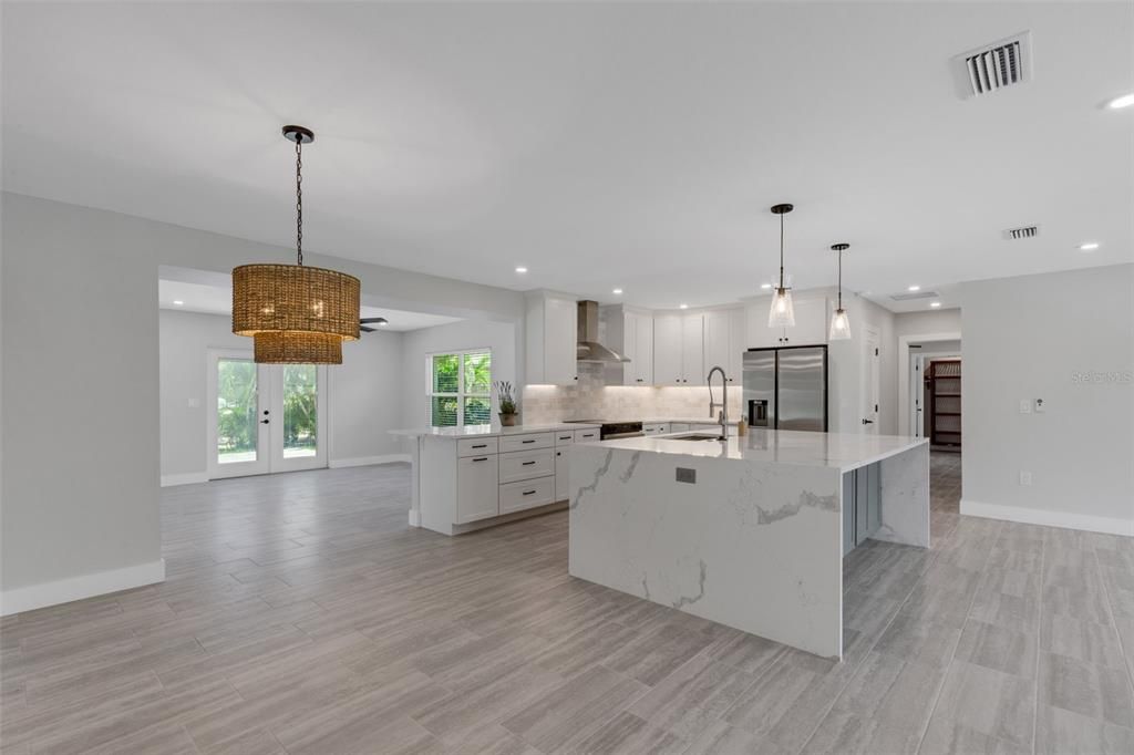 Chandelier, Interior, Kitchen, Pendant Lights, Recessed Lighting, Stainless Steel Appliances, Wood Texture Flooring