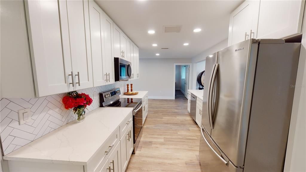 Interior, Kitchen, Recessed Lighting, Stainless Steel Appliances, Wood Texture Flooring
