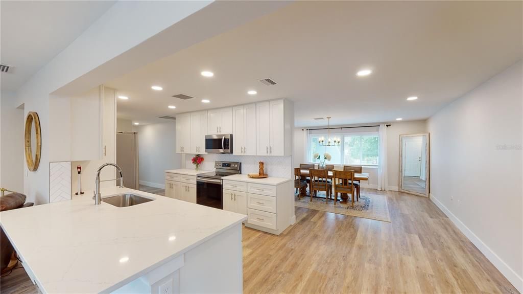 Dining room, Interior, Kitchen, Pendant Lights, Recessed Lighting, Stainless Steel Appliances, Wood Texture Flooring