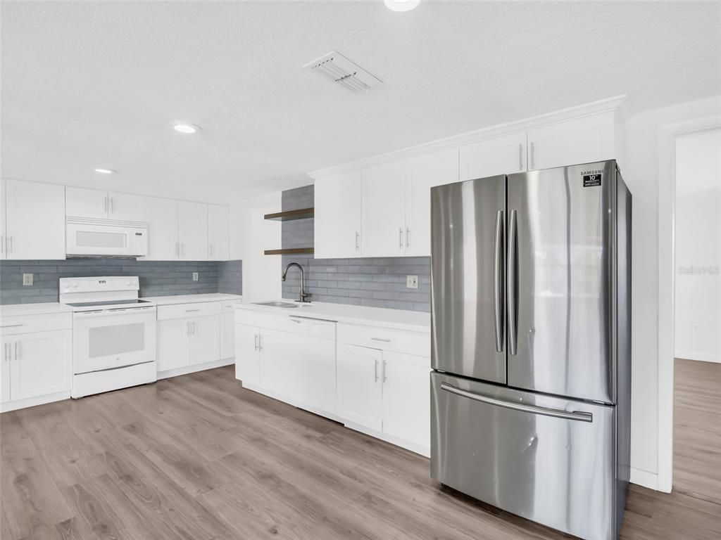 Interior, Kitchen, Recessed Lighting, Stainless Steel Appliances, Wood Texture Flooring