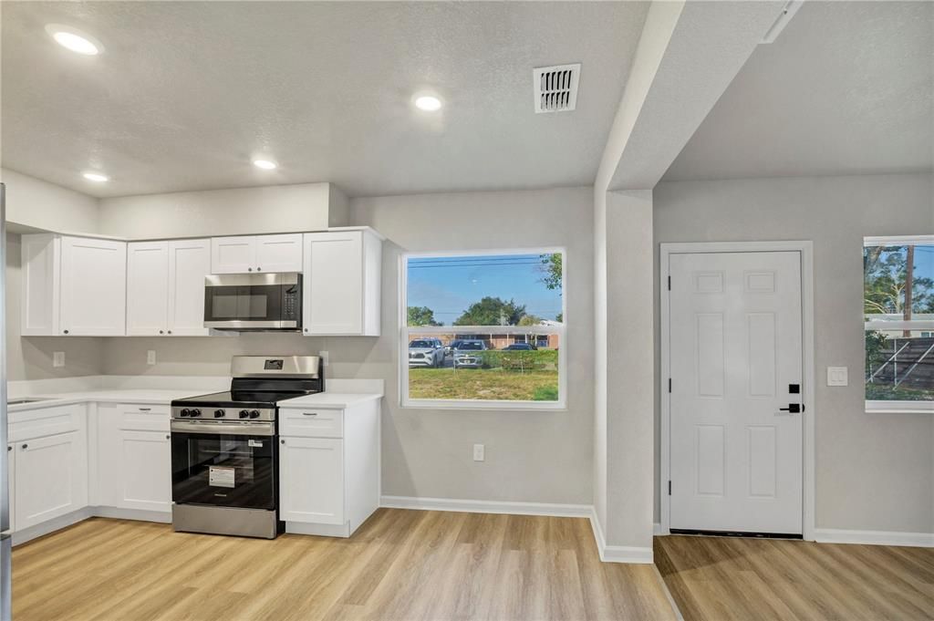 Interior, Kitchen, Recessed Lighting, Stainless Steel Appliances, Wood Texture Flooring