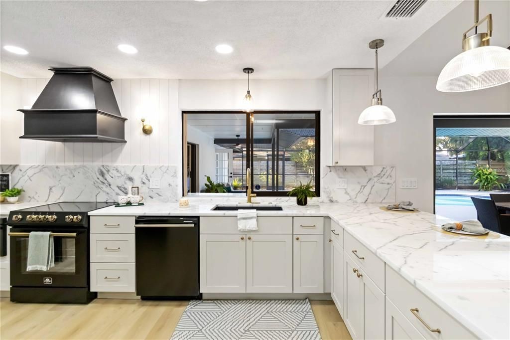 Interior, Kitchen, Marble Walls, Pendant Lights, Recessed Lighting, Stainless Steel Appliances, Wood Texture Flooring