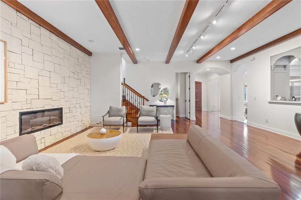Fireplace, Interior, Living room, Recessed Lighting, Stone Walls, Wooden Beams, Wood Texture Flooring