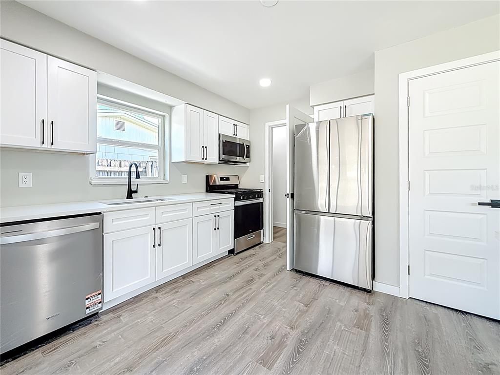 Interior, Kitchen, Recessed Lighting, Stainless Steel Appliances, Wood Texture Flooring