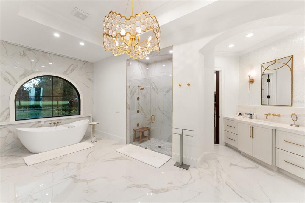 Bathroom, Chandelier, Dual Sink Vanities, Free Standing Baths, Glass Shower, Interior, Marble, Marble Walls, Recessed Lighting