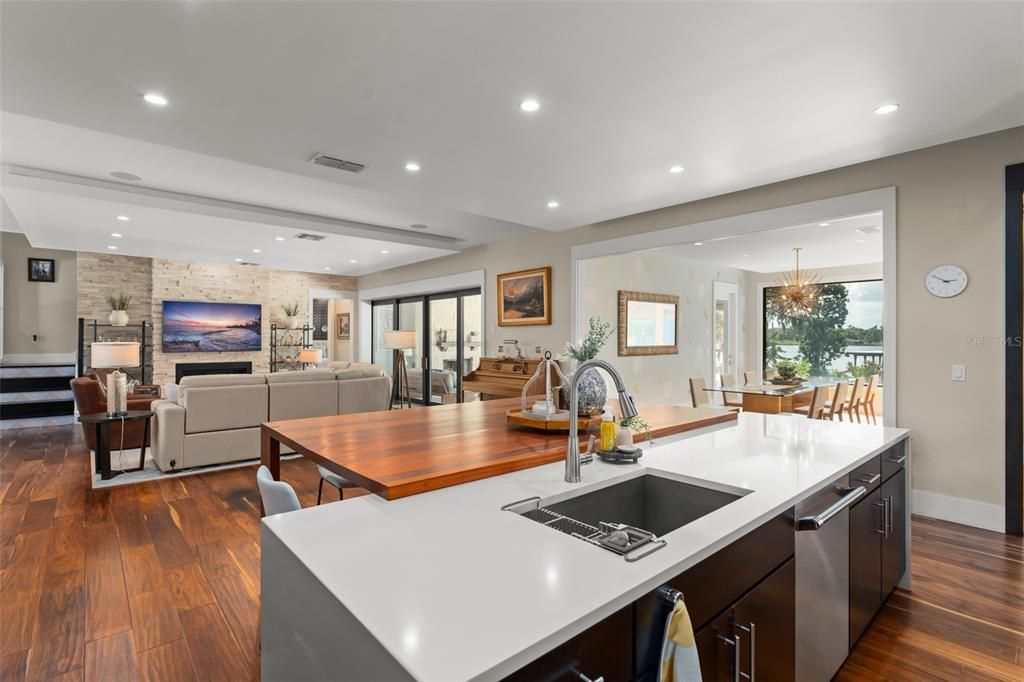 Chandelier, Dining room, Interior, Kitchen, Living room, Recessed Lighting, Stone Walls, Wood Texture Flooring
