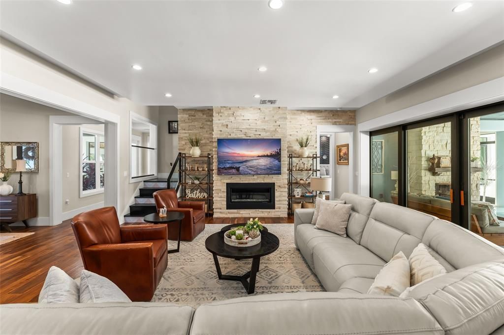 Fireplace, Interior, Living room, Recessed Lighting, Stone Walls, Wood Texture Flooring