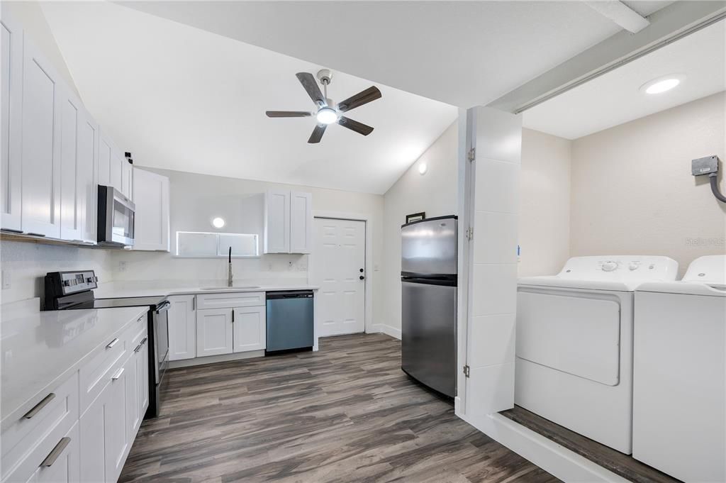 Interior, Kitchen, Recessed Lighting, Washer, Wood Texture Flooring