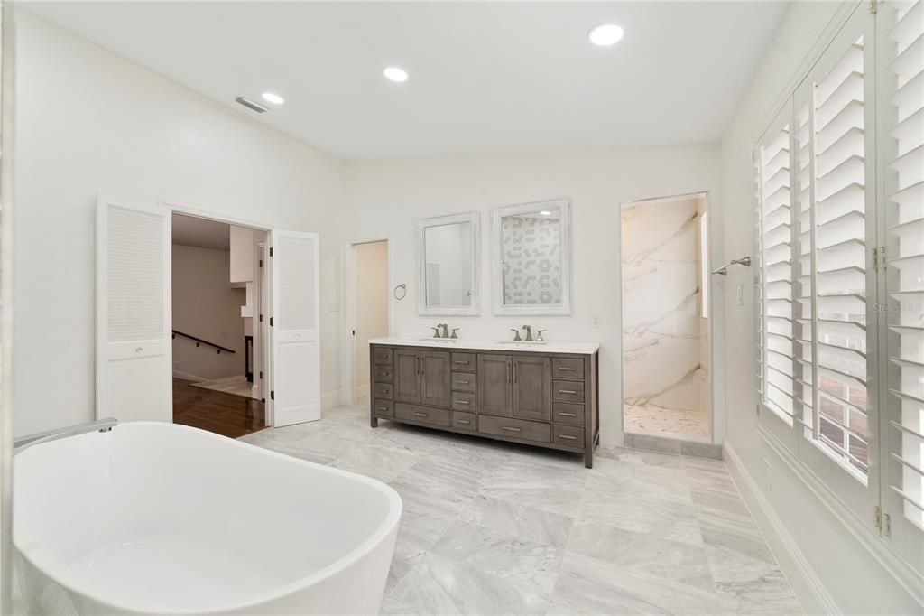 Bathroom, Dual Sink Vanities, Free Standing Baths, Interior, Marble, Marble Walls, Recessed Lighting