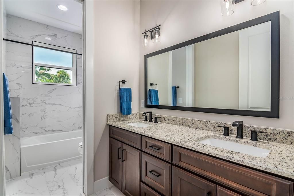 Bathroom, Dual Sink Vanities, Interior, Marble, Marble Walls, Recessed Lighting