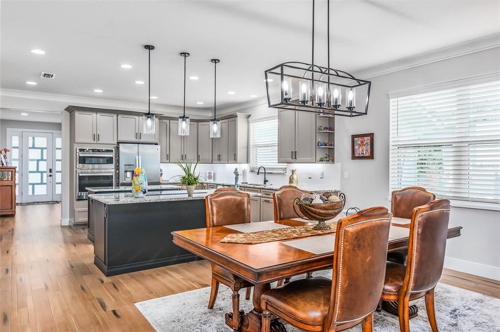 Dining room, Interior, Kitchen, Pendant Lights, Recessed Lighting, Stainless Steel Appliances, Wood Texture Flooring