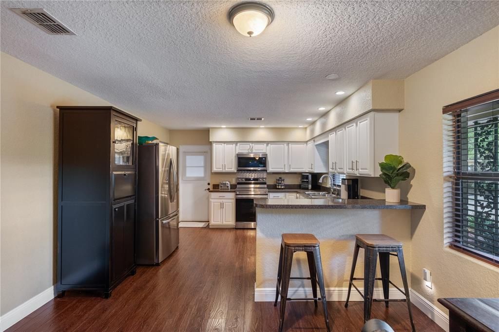 Interior, Kitchen, Recessed Lighting, Stainless Steel Appliances, Wood Texture Flooring