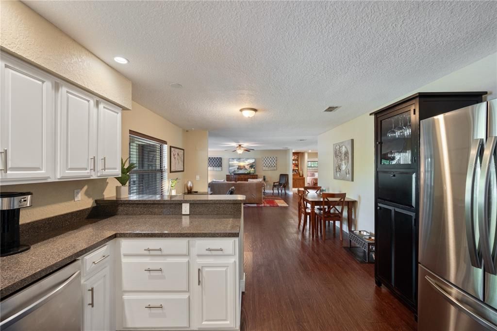 Dining room, Interior, Kitchen, Recessed Lighting, Stainless Steel Appliances, Wood Texture Flooring