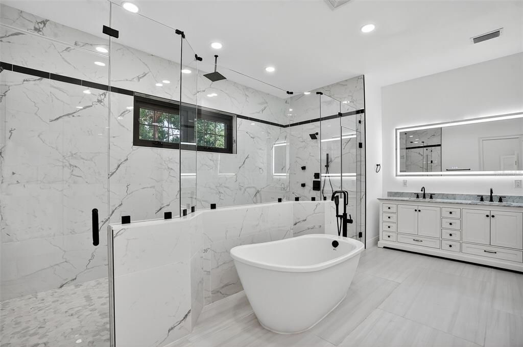 Bathroom, Dual Sink Vanities, Free Standing Baths, Glass Shower, Interior, Marble Walls, Recessed Lighting