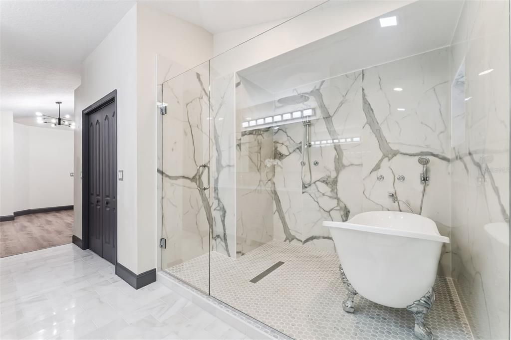 Bathroom, Free Standing Baths, Glass Shower, Interior, Marble, Marble Walls, Wood Texture Flooring