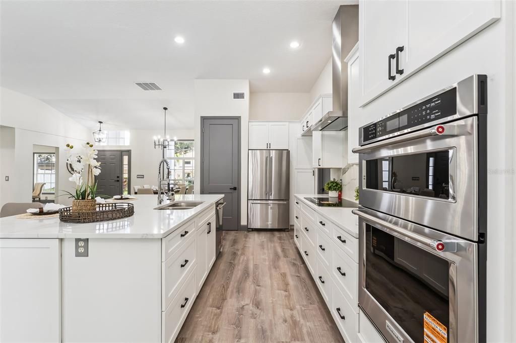 Chandelier, Interior, Kitchen, Pendant Lights, Recessed Lighting, Stainless Steel Appliances, Wood Texture Flooring