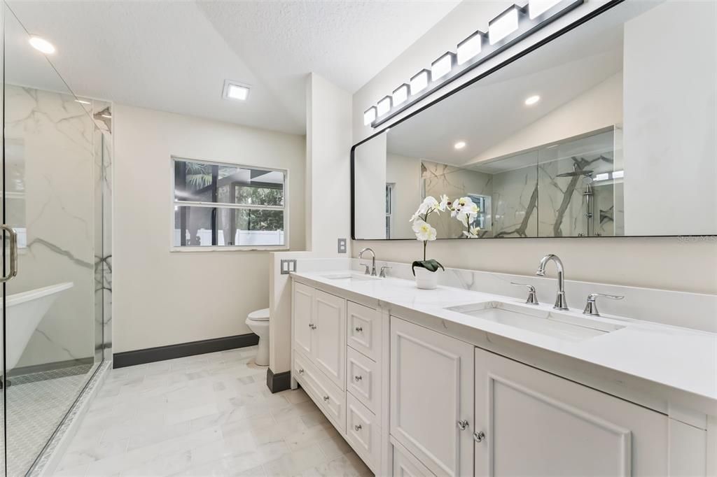 Bathroom, Dual Sink Vanities, Glass Shower, Interior, Marble, Marble Walls, Recessed Lighting