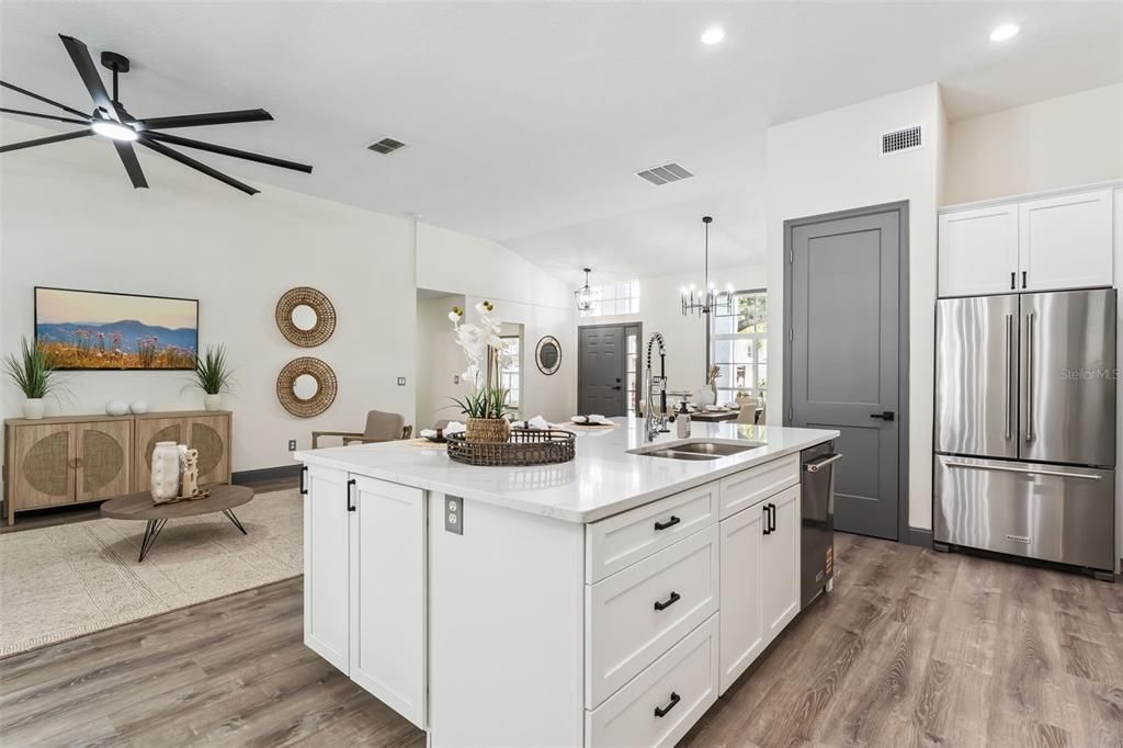 Chandelier, Dining room, Interior, Kitchen, Recessed Lighting, Stainless Steel Appliances, Wood Texture Flooring