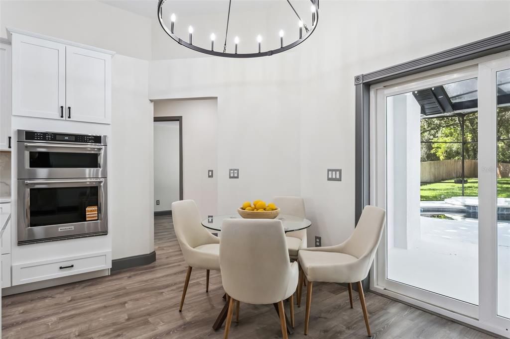 Dining room, Interior, Kitchen, Pendant Lights, Stainless Steel Appliances, Wood Texture Flooring