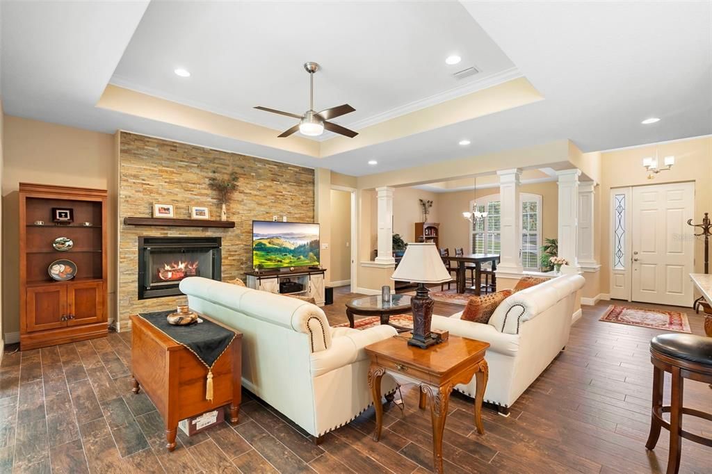 Chandelier, Dining room, Fireplace, Interior, Living room, Recessed Lighting, Stone Walls, Wood Texture Flooring