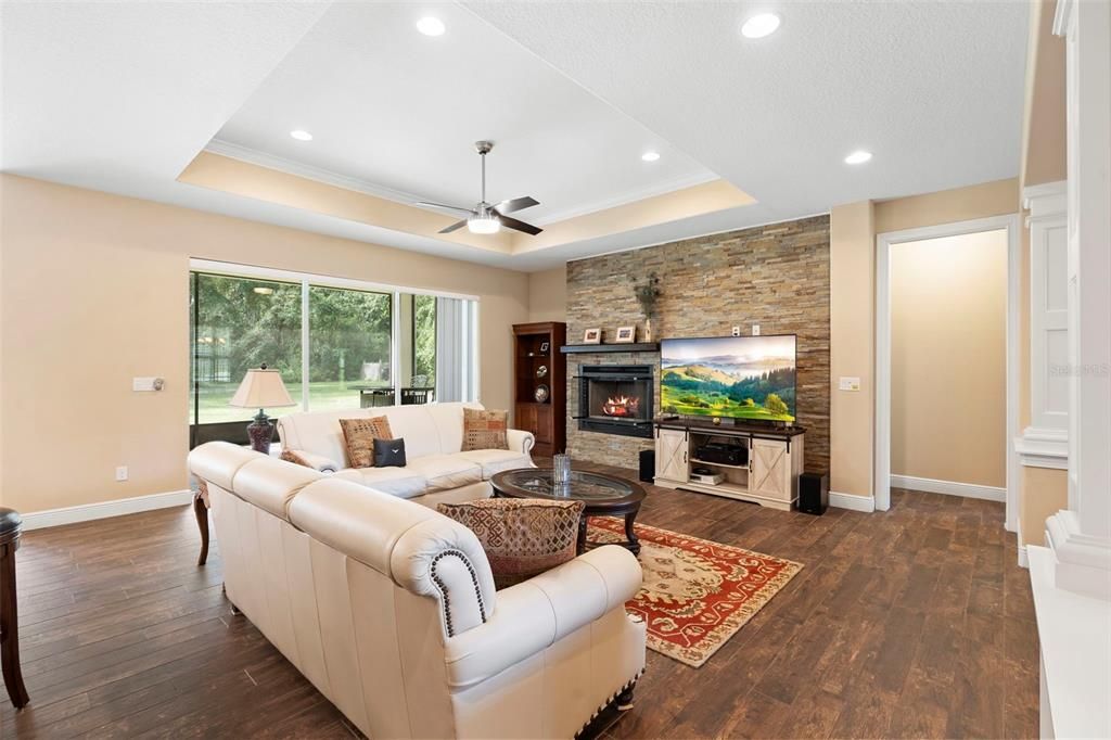 Fireplace, Interior, Living room, Recessed Lighting, Stone Walls, Wood Texture Flooring