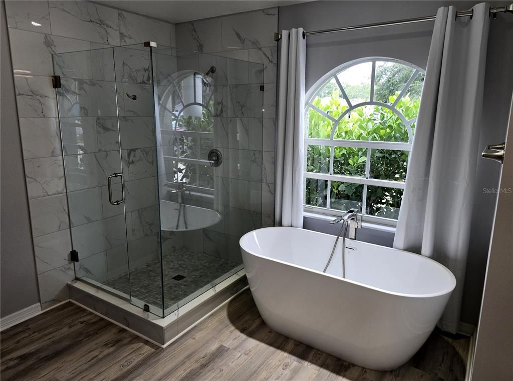 Bathroom, Free Standing Baths, Glass Shower, Interior, Marble Walls, Wood Texture Flooring