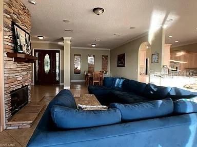 Dining room, Fireplace, Interior, Living room, Recessed Lighting, Stone Walls