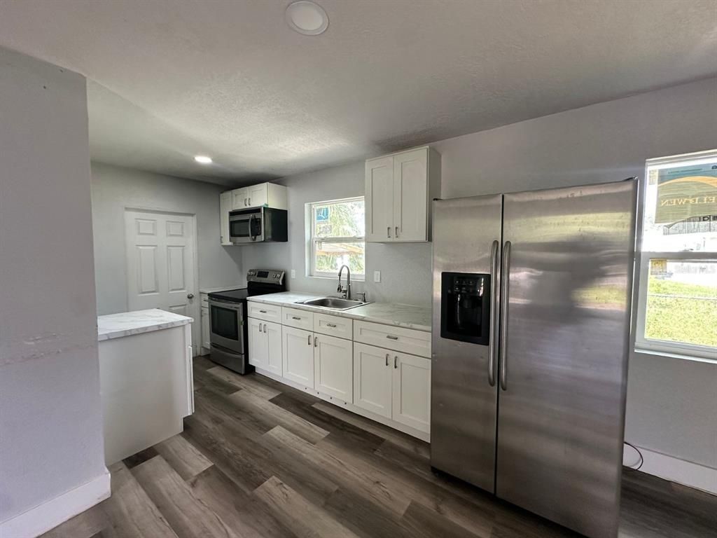Interior, Kitchen, Recessed Lighting, Stainless Steel Appliances, Wood Texture Flooring
