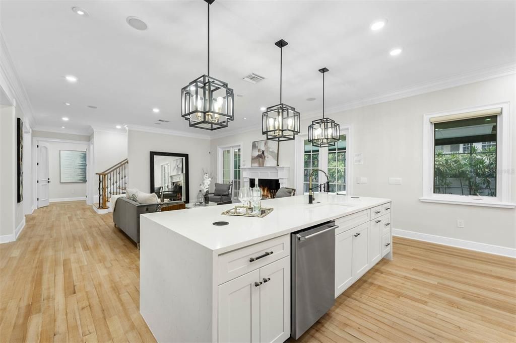 Fireplace, Interior, Kitchen, Living room, Pendant Lights, Recessed Lighting, Stainless Steel Appliances, Wood Texture Flooring