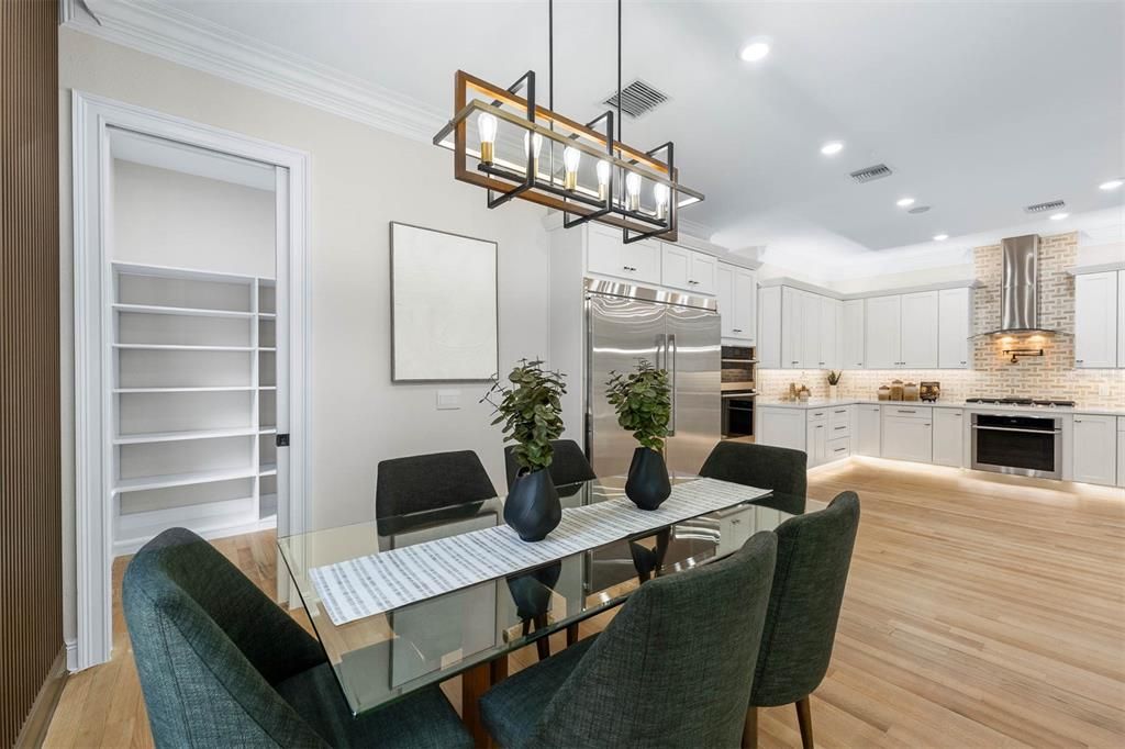 Dining room, Interior, Kitchen, Pendant Lights, Recessed Lighting, Stainless Steel Appliances, Wood Texture Flooring
