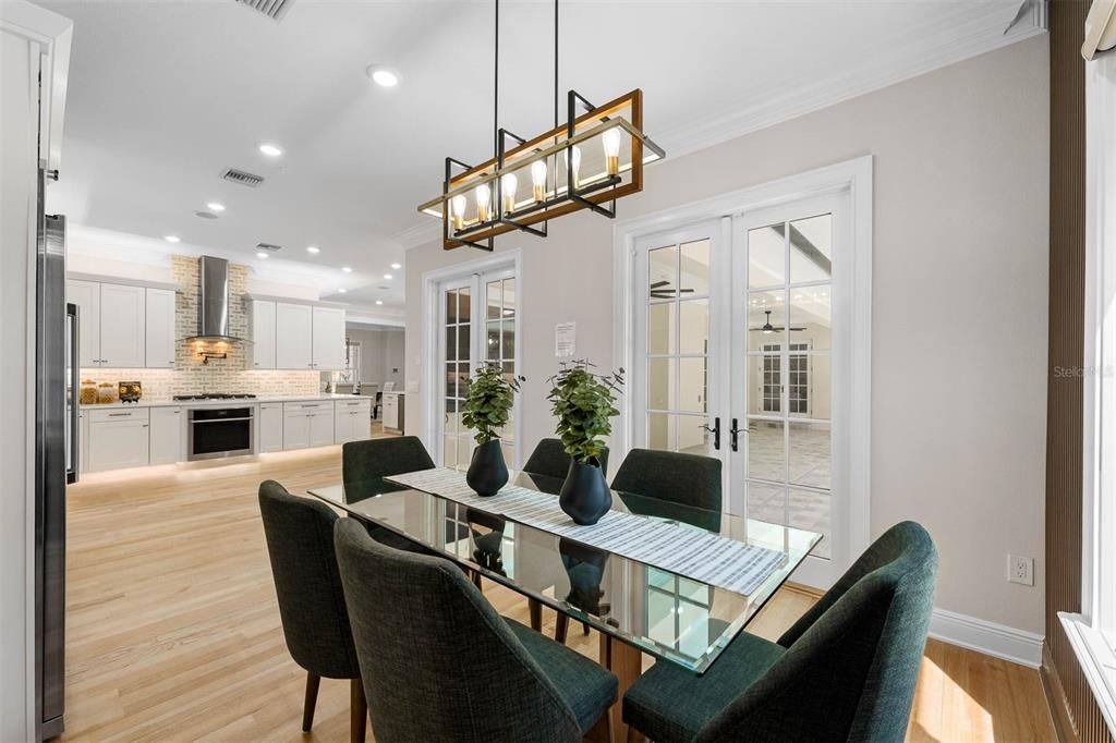 Dining room, Interior, Kitchen, Pendant Lights, Recessed Lighting, Stainless Steel Appliances, Wood Texture Flooring