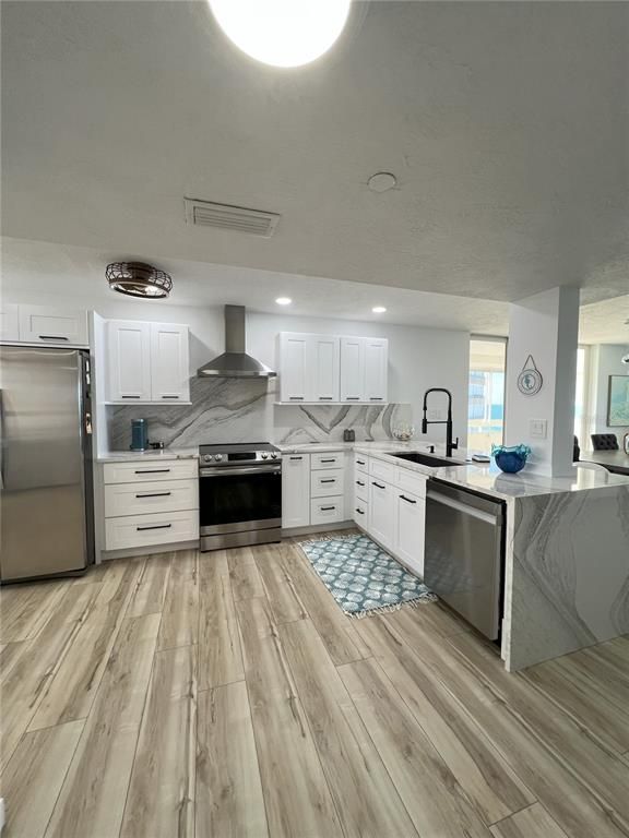 Interior, Kitchen, Marble Walls, Recessed Lighting, Stainless Steel Appliances, Wood Texture Flooring