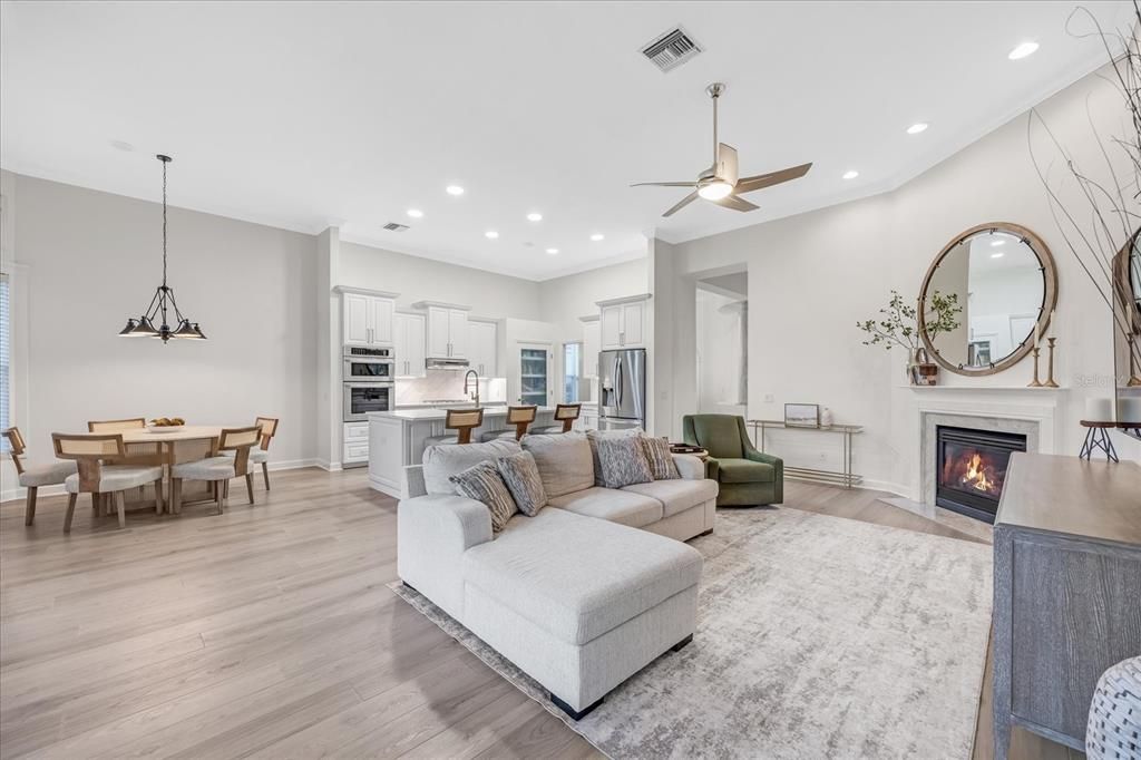 Dining room, Fireplace, Interior, Kitchen, Living room, Pendant Lights, Recessed Lighting, Stainless Steel Appliances, Wood Texture Flooring