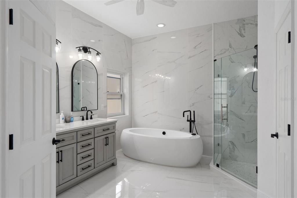 Bathroom, Dual Sink Vanities, Free Standing Baths, Glass Shower, Interior, Marble, Marble Walls, Recessed Lighting