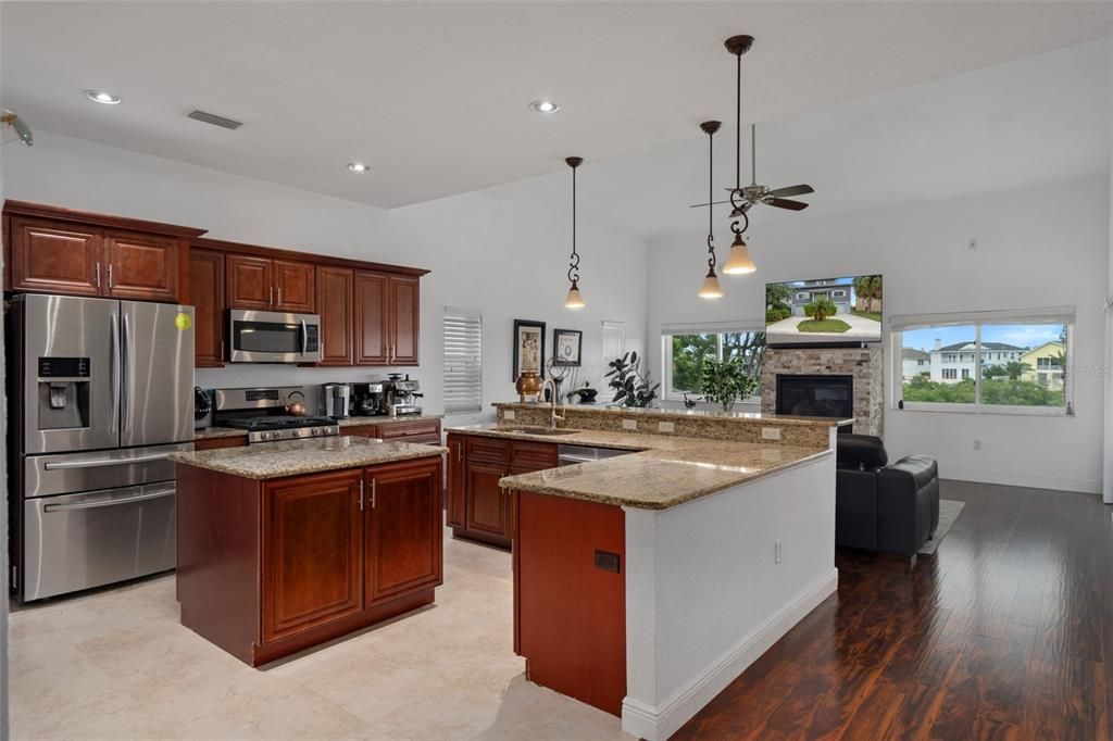 Fireplace, Interior, Kitchen, Pendant Lights, Recessed Lighting, Stainless Steel Appliances, Wood Texture Flooring