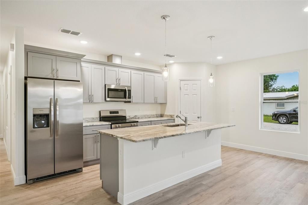Interior, Kitchen, Pendant Lights, Recessed Lighting, Stainless Steel Appliances, Wood Texture Flooring