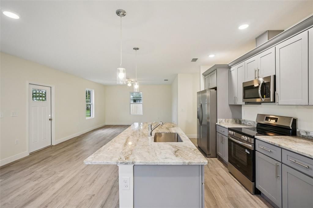 Interior, Kitchen, Pendant Lights, Recessed Lighting, Stainless Steel Appliances, Wood Texture Flooring