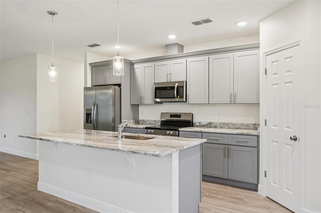 Interior, Kitchen, Pendant Lights, Recessed Lighting, Stainless Steel Appliances, Wood Texture Flooring