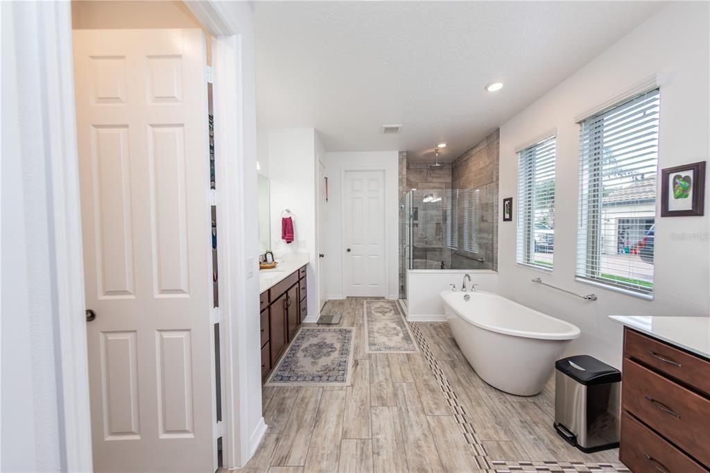 Bathroom, Dual Sink Vanities, Free Standing Baths, Glass Shower, Interior, Recessed Lighting, Wood Texture Flooring