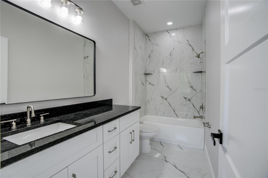 Bathroom, Dual Sink Vanities, Interior, Marble, Marble Walls, Recessed Lighting