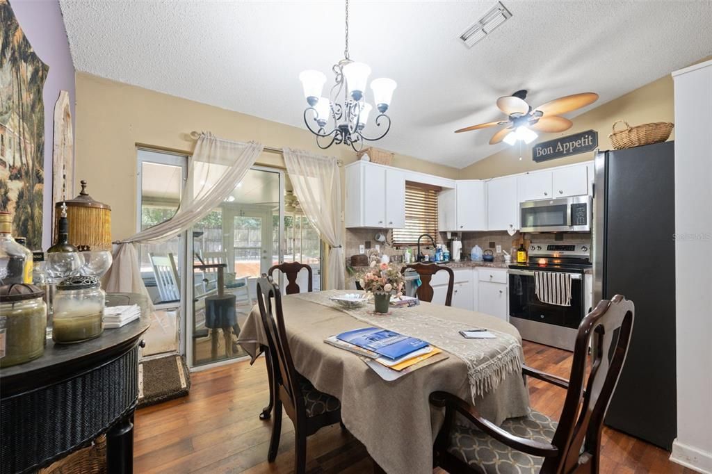 Chandelier, Dining room, Interior, Kitchen, Stainless Steel Appliances, Wood Texture Flooring