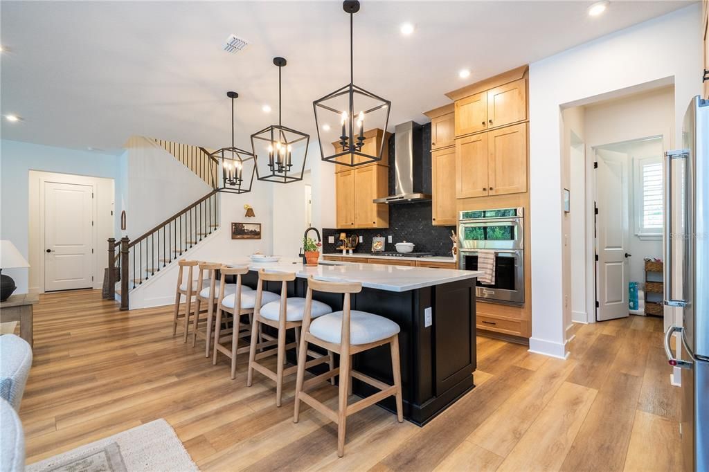 Dining room, Interior, Kitchen, Pendant Lights, Recessed Lighting, Stainless Steel Appliances, Wood Texture Flooring