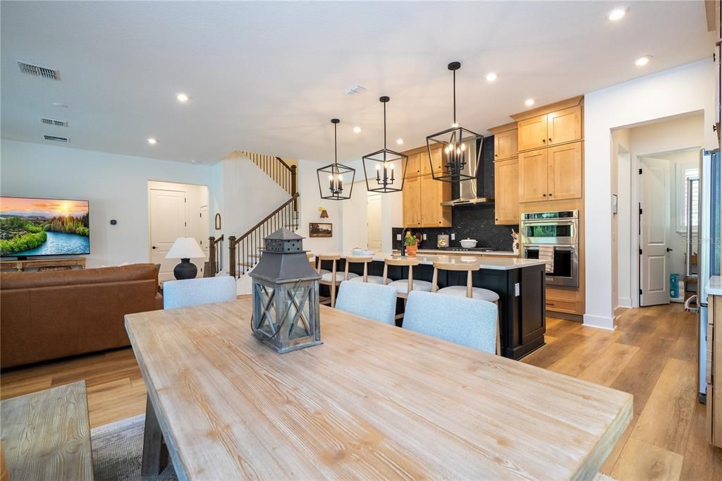 Dining room, Interior, Kitchen, Living room, Pendant Lights, Recessed Lighting, Stainless Steel Appliances, Wood Texture Flooring