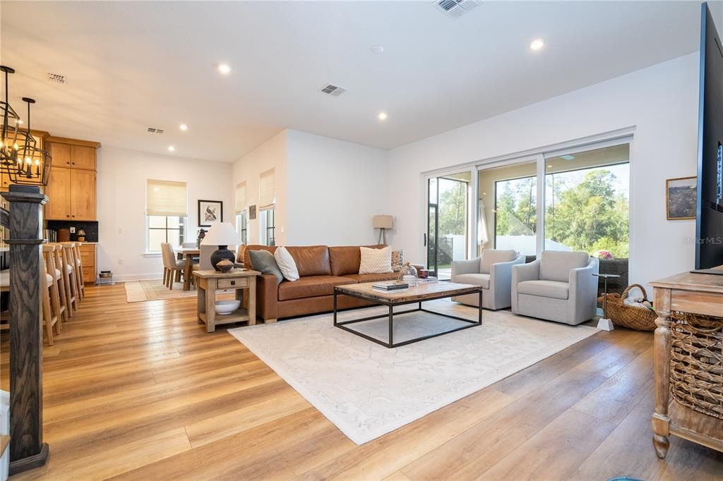 Dining room, Fireplace, Interior, Living room, Pendant Lights, Recessed Lighting, Wood Texture Flooring