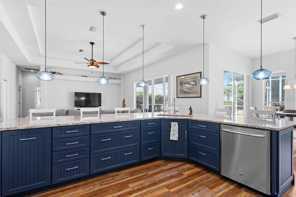 Dining room, Interior, Kitchen, Pendant Lights, Recessed Lighting, Stainless Steel Appliances, Wood Texture Flooring