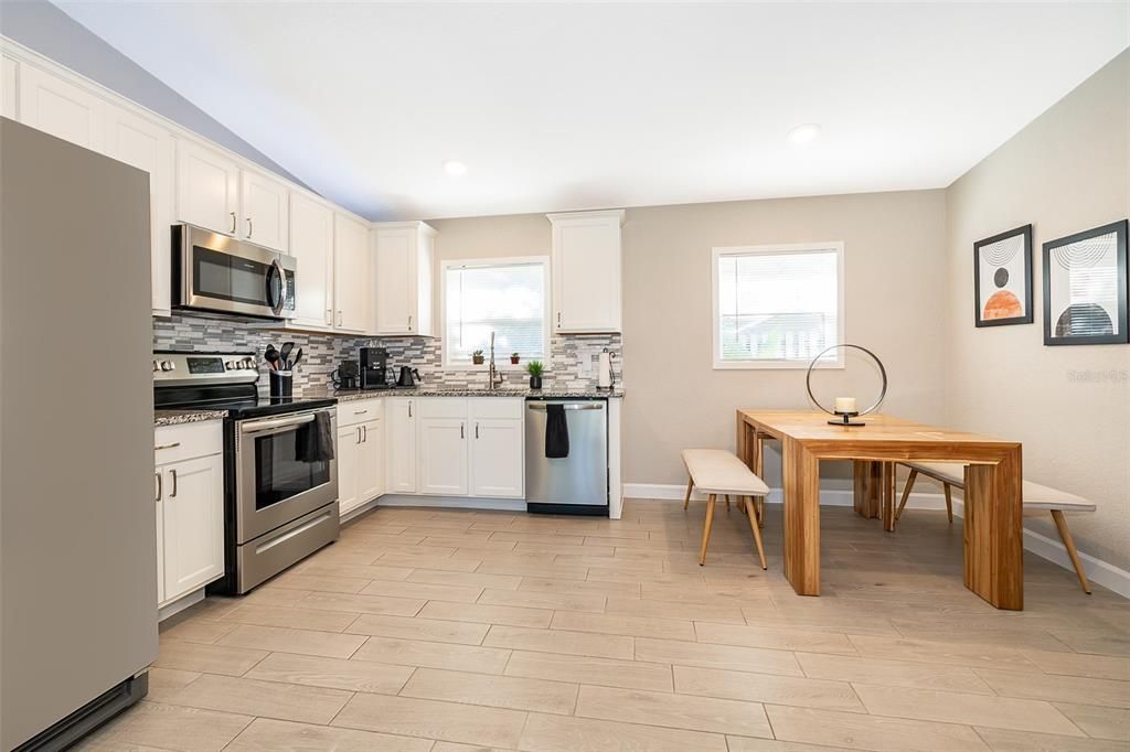 Dining room, Interior, Kitchen, Recessed Lighting, Stainless Steel Appliances, Wood Texture Flooring