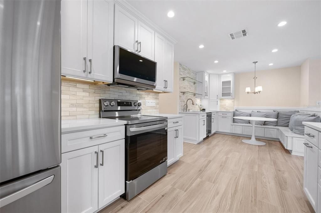 Chandelier, Interior, Kitchen, Pendant Lights, Recessed Lighting, Stainless Steel Appliances, Stone Walls, Wood Texture Flooring